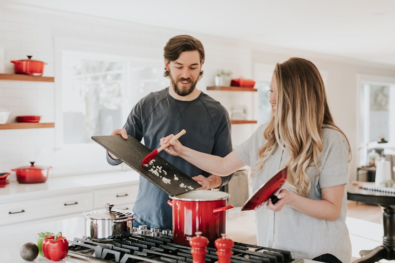 Professional oven repair in a residential kitchen with gas range and modern appliances